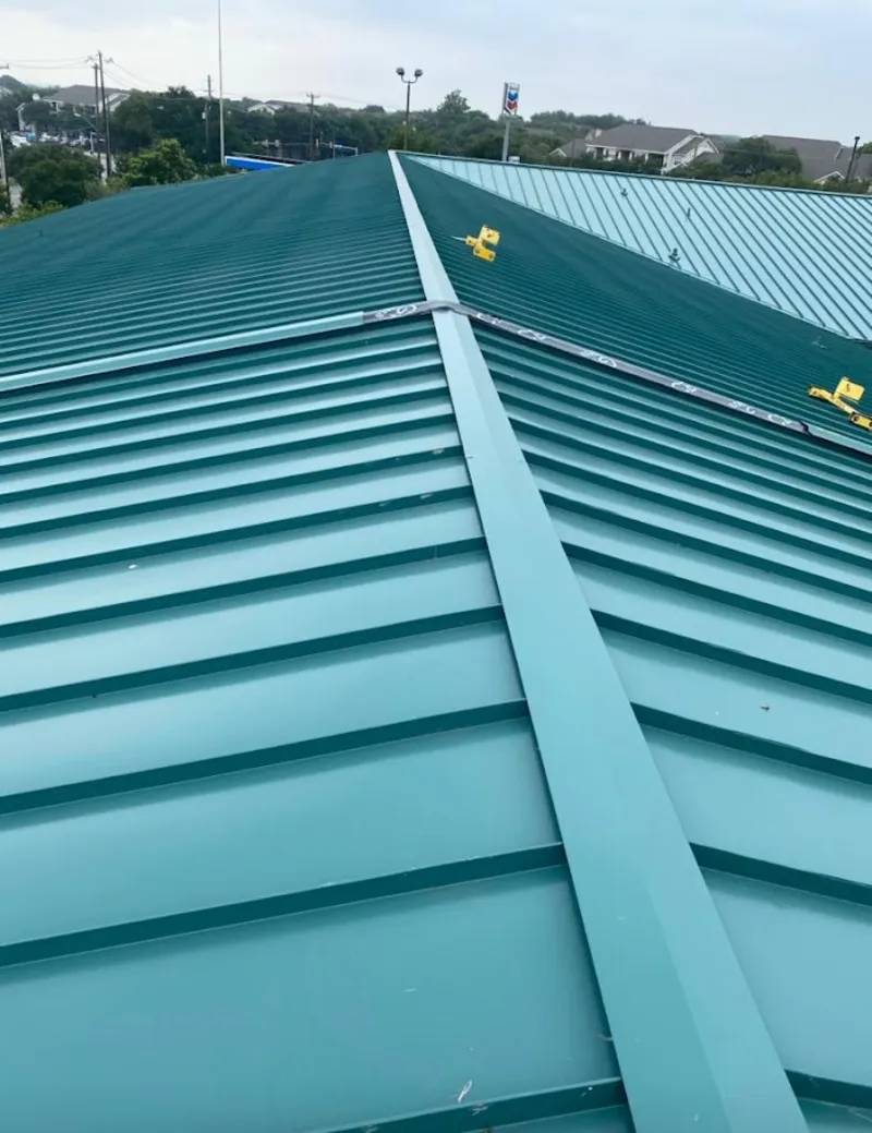 Green commercial metal roof ridge and valley for Metal Roof Repair in Centennial