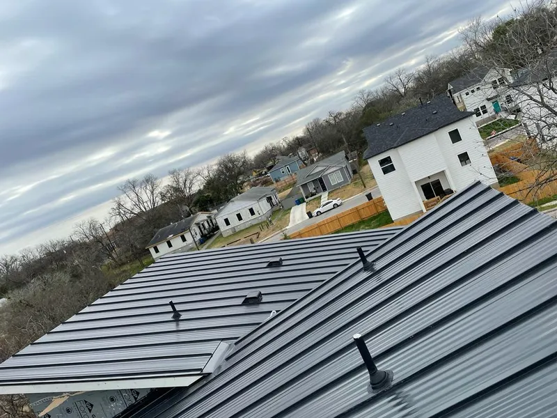 Standing seam metal roof panels with vents for Skylight Repair in Centennial
